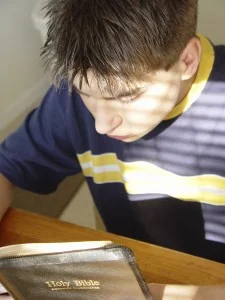 Young Boy reading Bible
