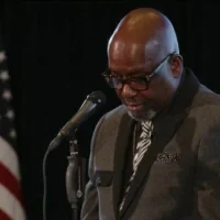 Pastor Dennis Hodges praying